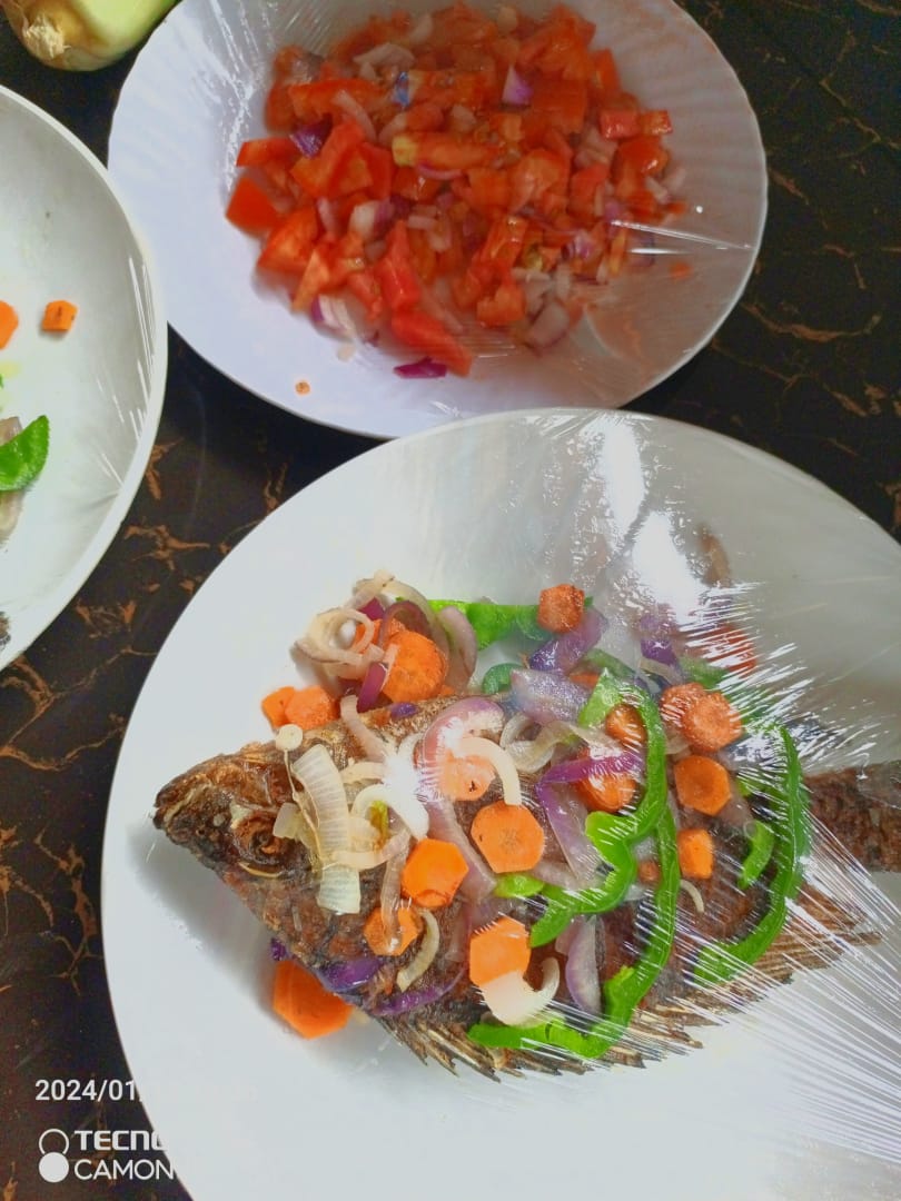 Grilled Tilapia with Ugali and Kachumbari at Ambururu
